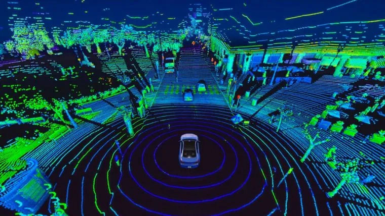 A LiDAR point cloud view from a self-driving car, showing a detailed 3D map of a city street at night with buildings, trees, and other cars visualized in glowing green and blue dots.